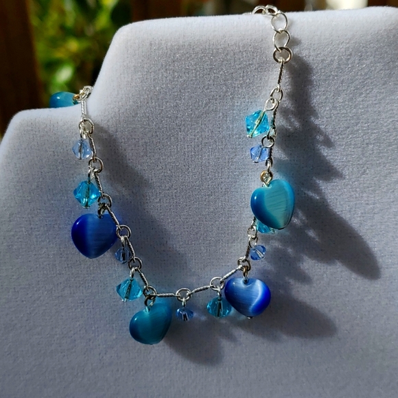 Avon Jewelry - Vintage Avon cats eye bracelet and earrings set. blue shaded stones and silver